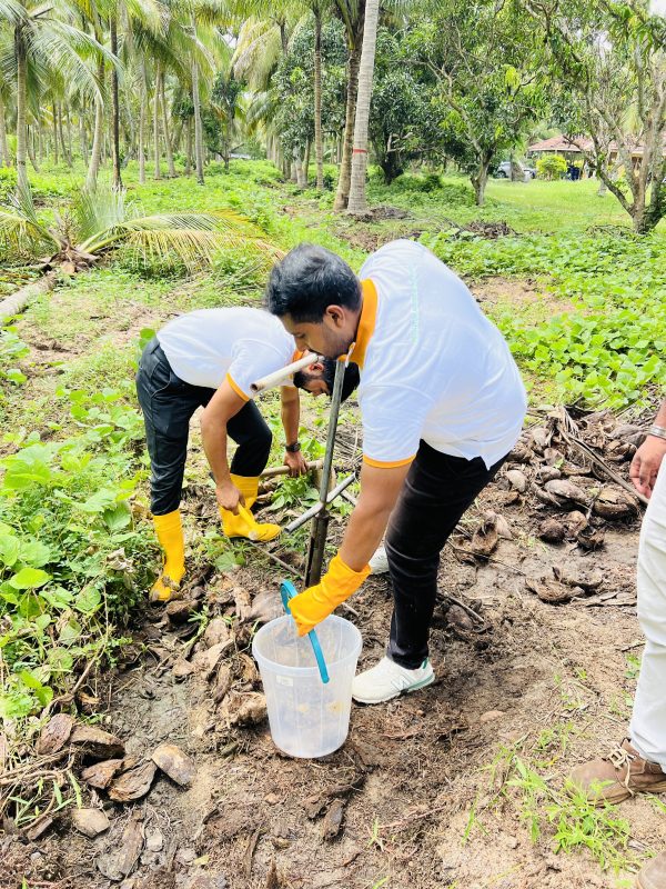 Biogenic Soil Sense team collecting soil samples in a coconut plantation in Bingiriya Sri Lanka for nutrient analysis and precision fertilizer management

