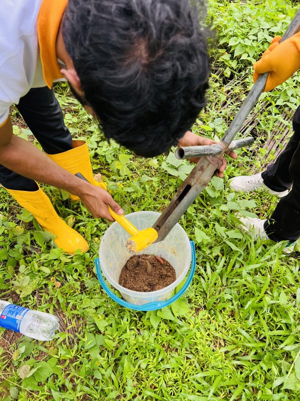 Biogenic Soil Sense team collecting soil samples in a coconut plantation in Bingiriya Sri Lanka for nutrient analysis and precision fertilizer management
